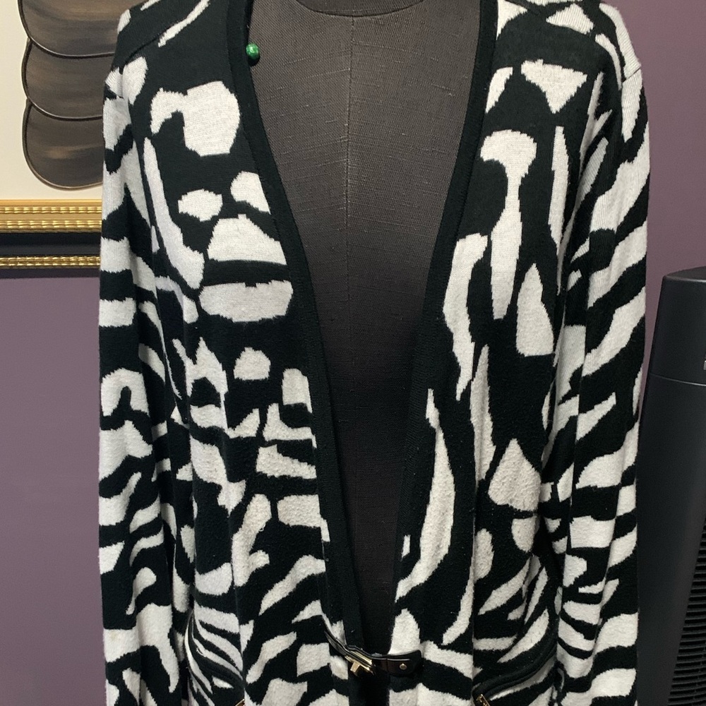 Calvin Klein long cardigan with gold enclosure.